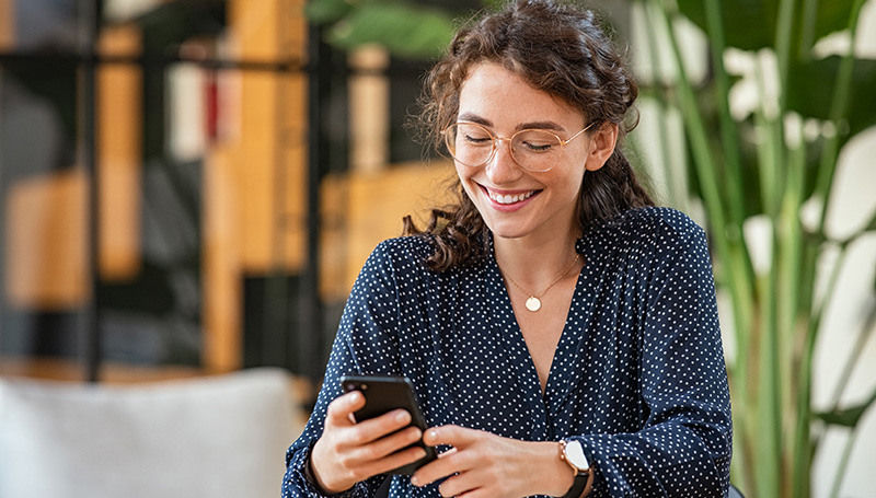 woman holding cell phone