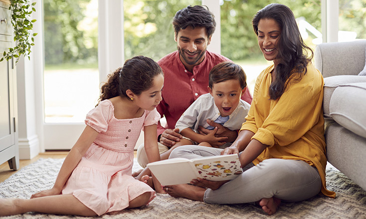 family reading a book