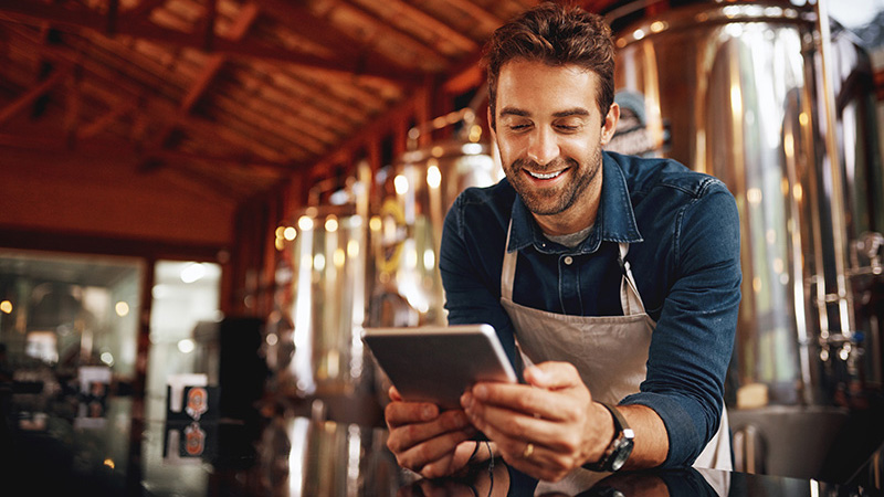 man looking at tablet