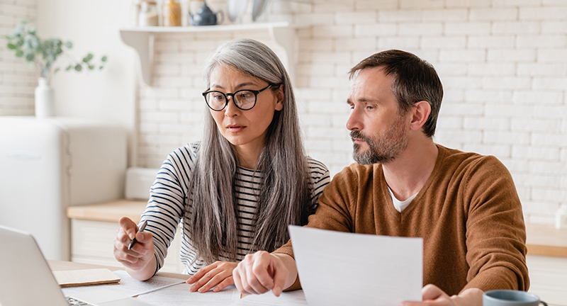 man and woman doing paperwork